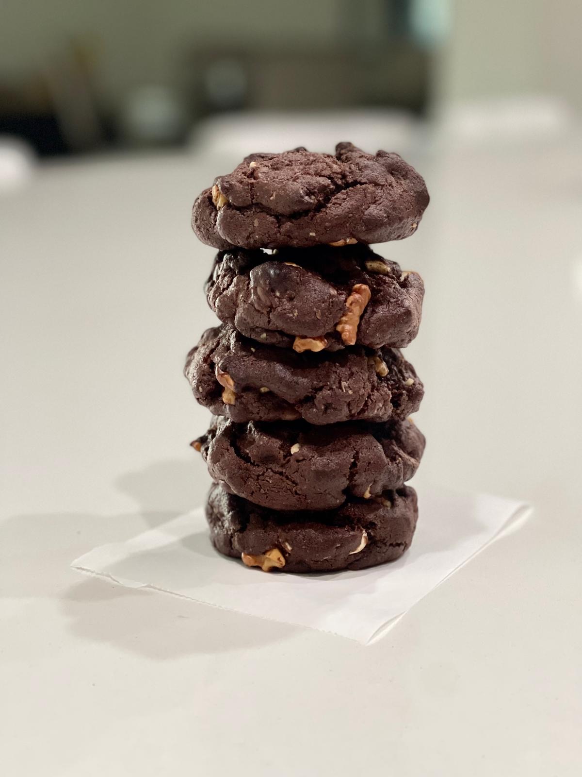 A stack of Krivian triple chocolate cookies